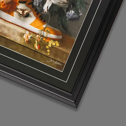 Artwork in a black frame with a gold slip and deep white mount
